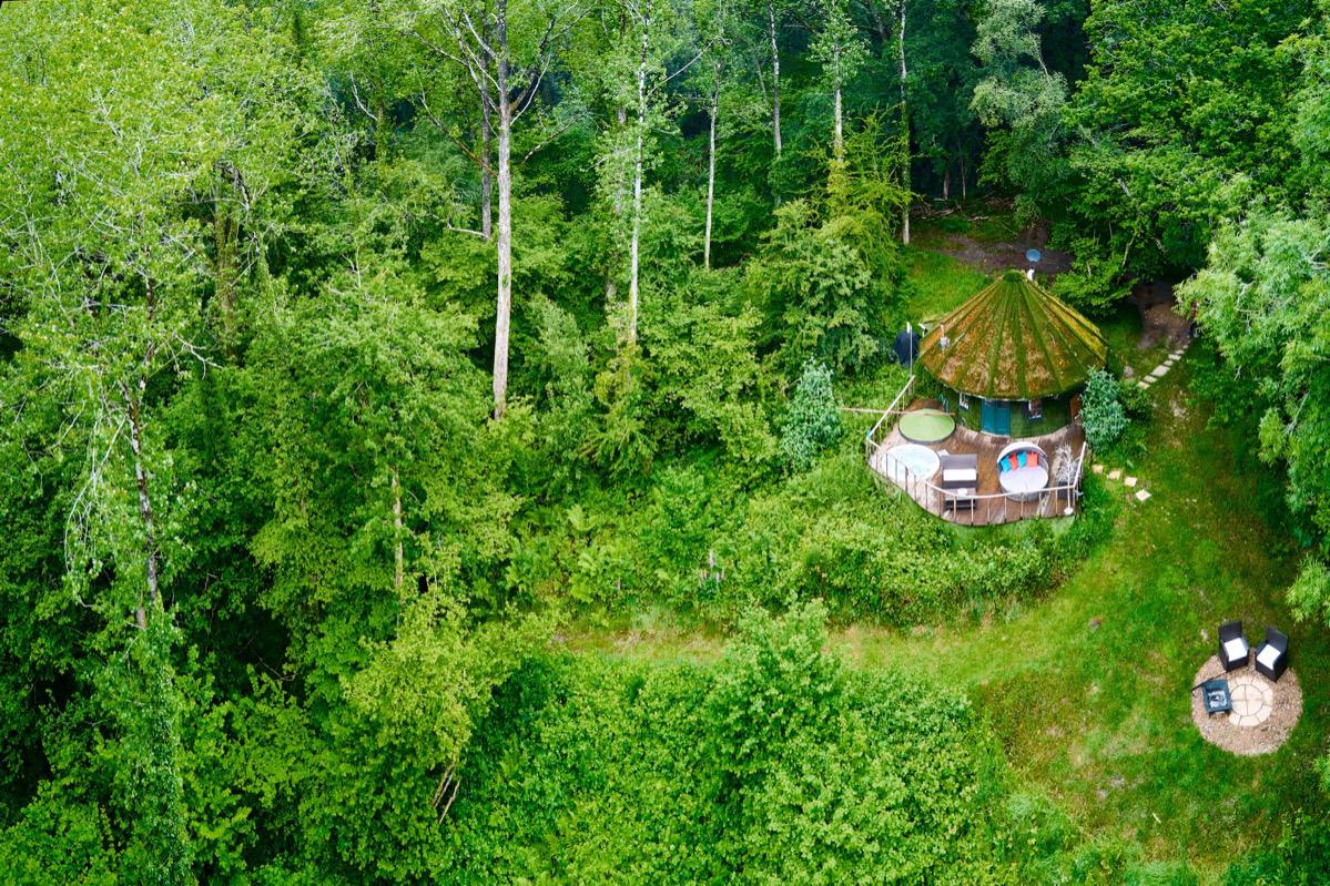 Birds-eye view of the roundhouse in a woodland setting