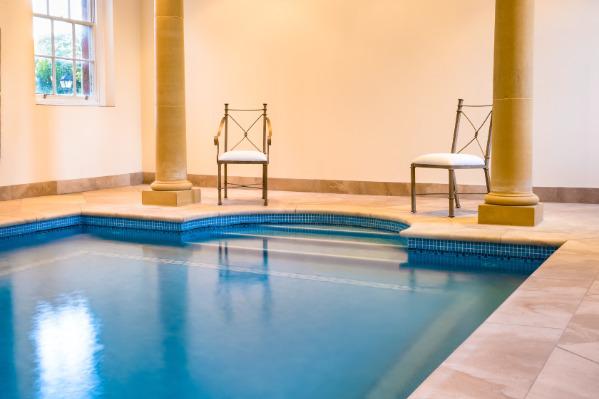 Two chairs overlooking the swimming pool