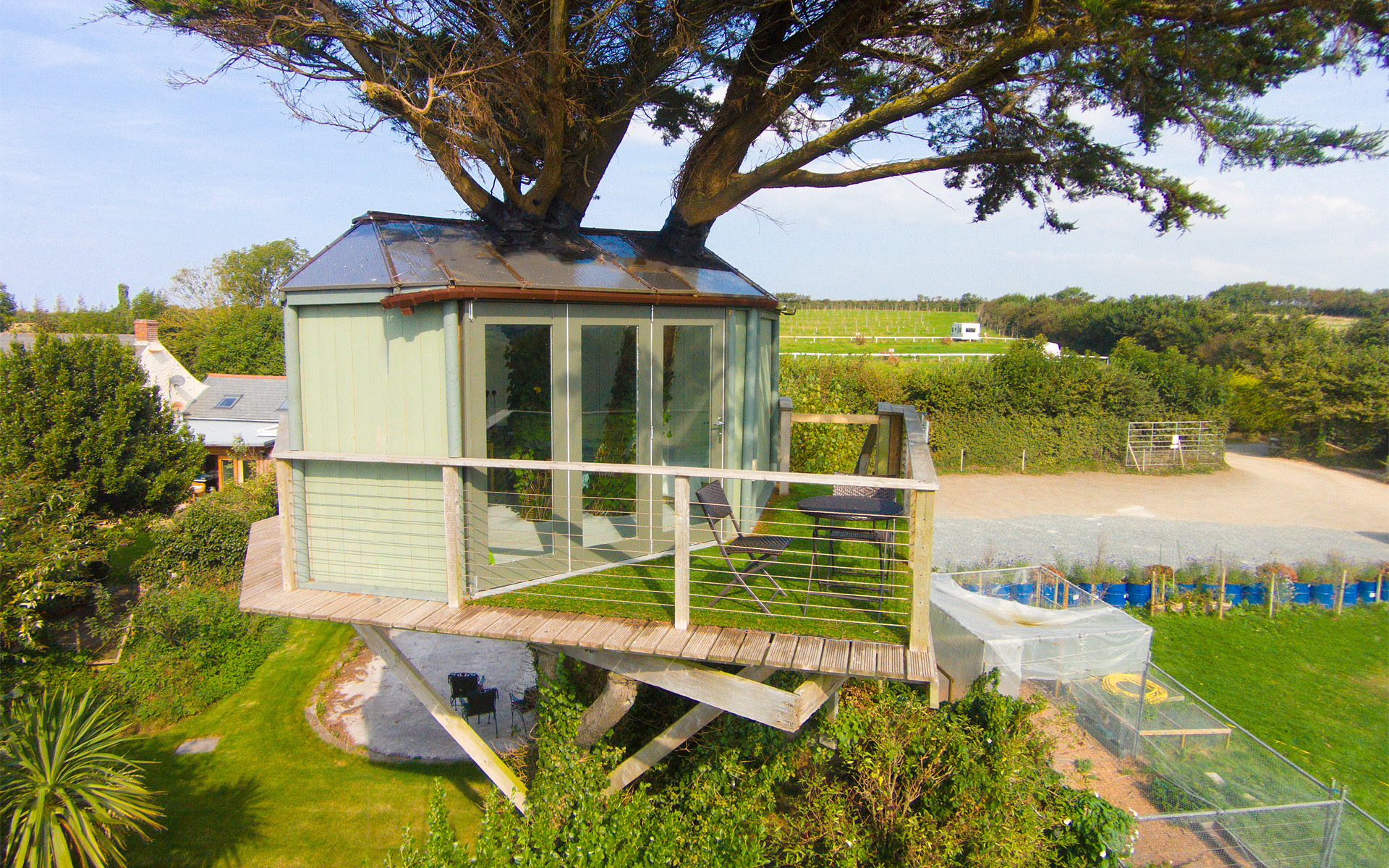 Exterior of raised treehouse with seaviews